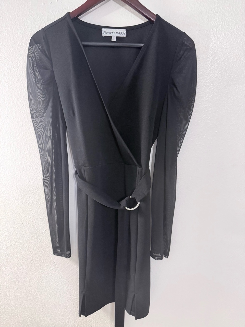 Almost Famous Black Wrap Dress with 
Sheer Long Sleeves & Decorative Ring (NWOT)